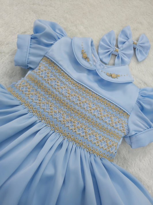 Baby blue satin with gold smocking